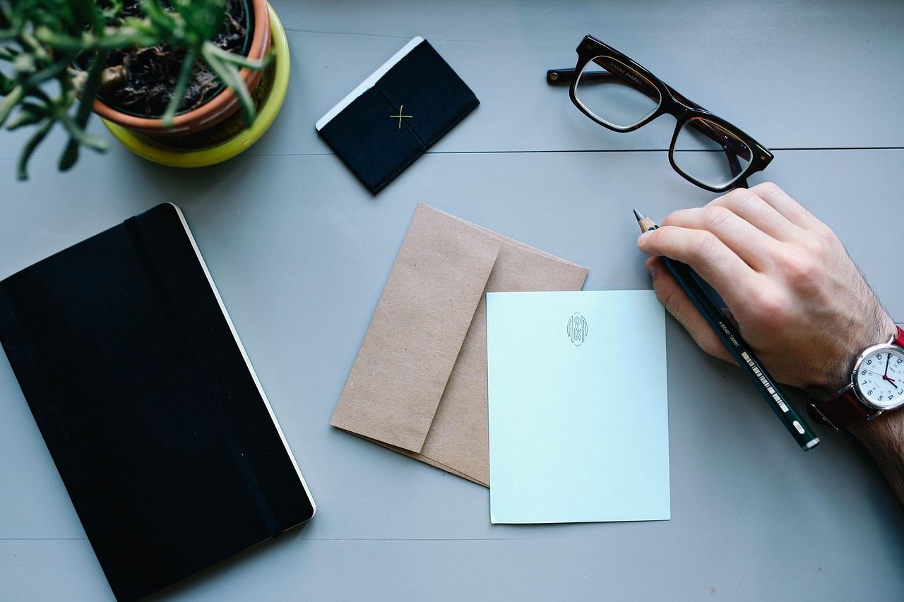 hand, man, watch, work, desk, workspace, people, business, male, person, businessman, letter, envelope, pen, writing, notebooks, business, business, letter, letter, letter, letter, letter, envelope, writing